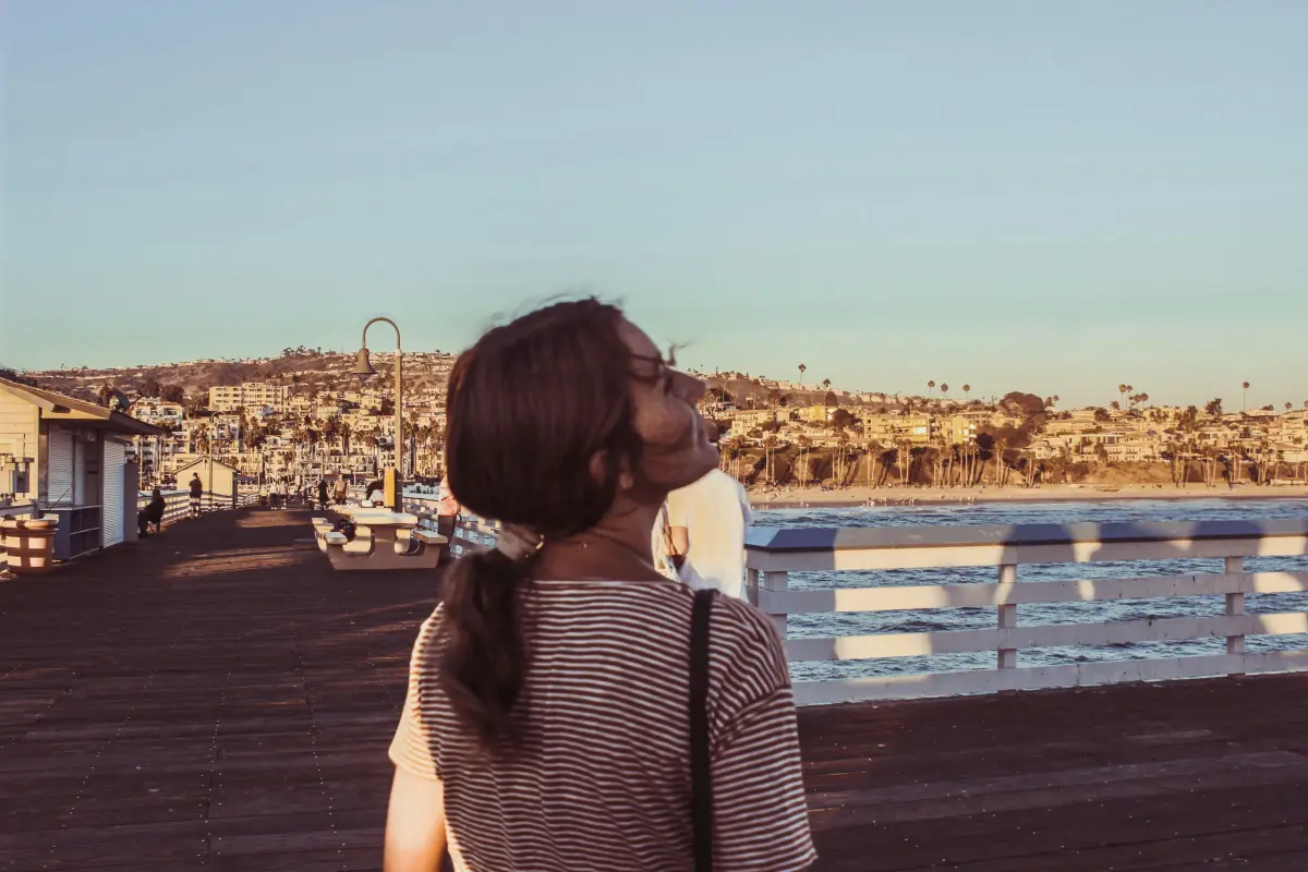 Strolling at sunset on a pier