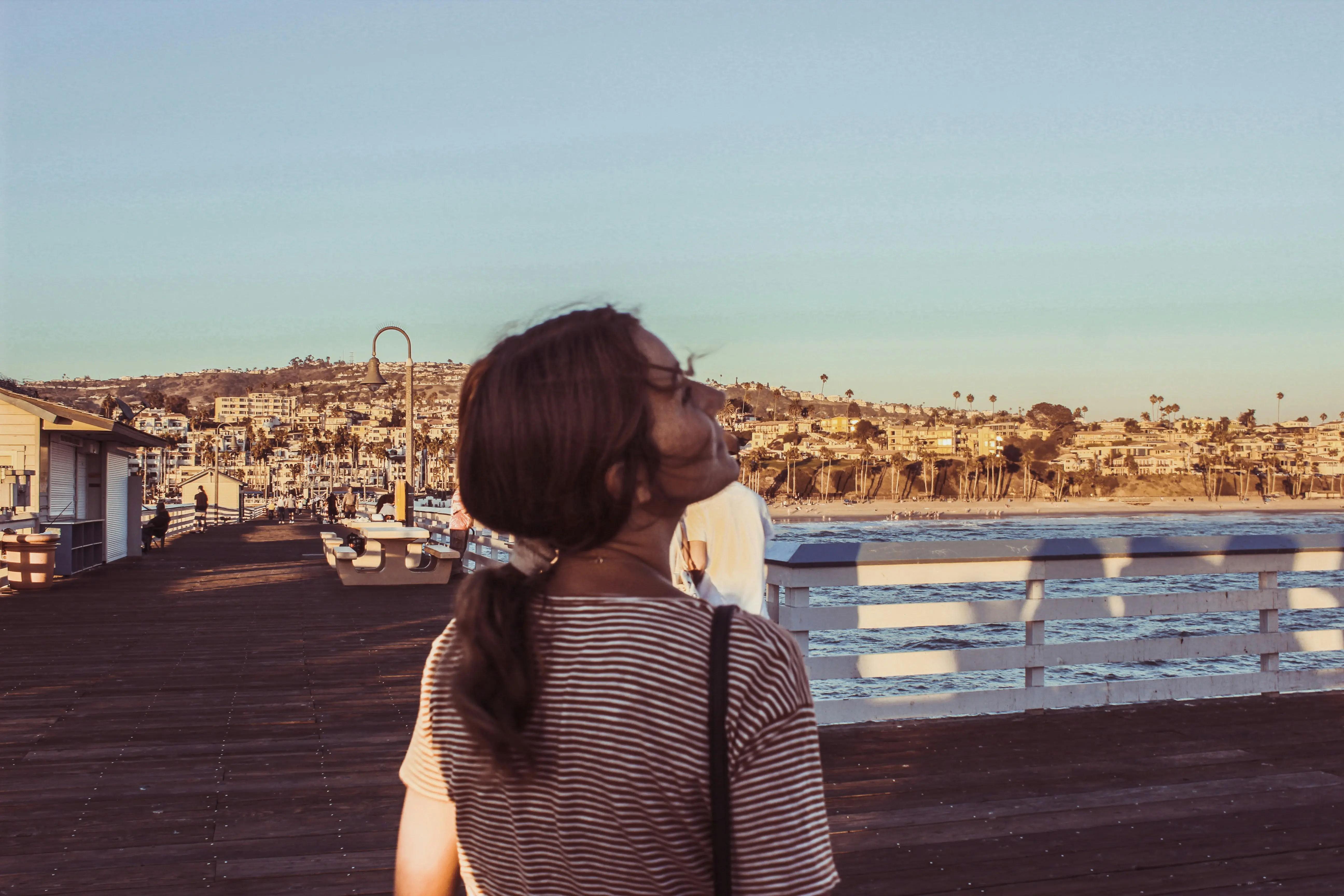 Strolling at sunset on a pier